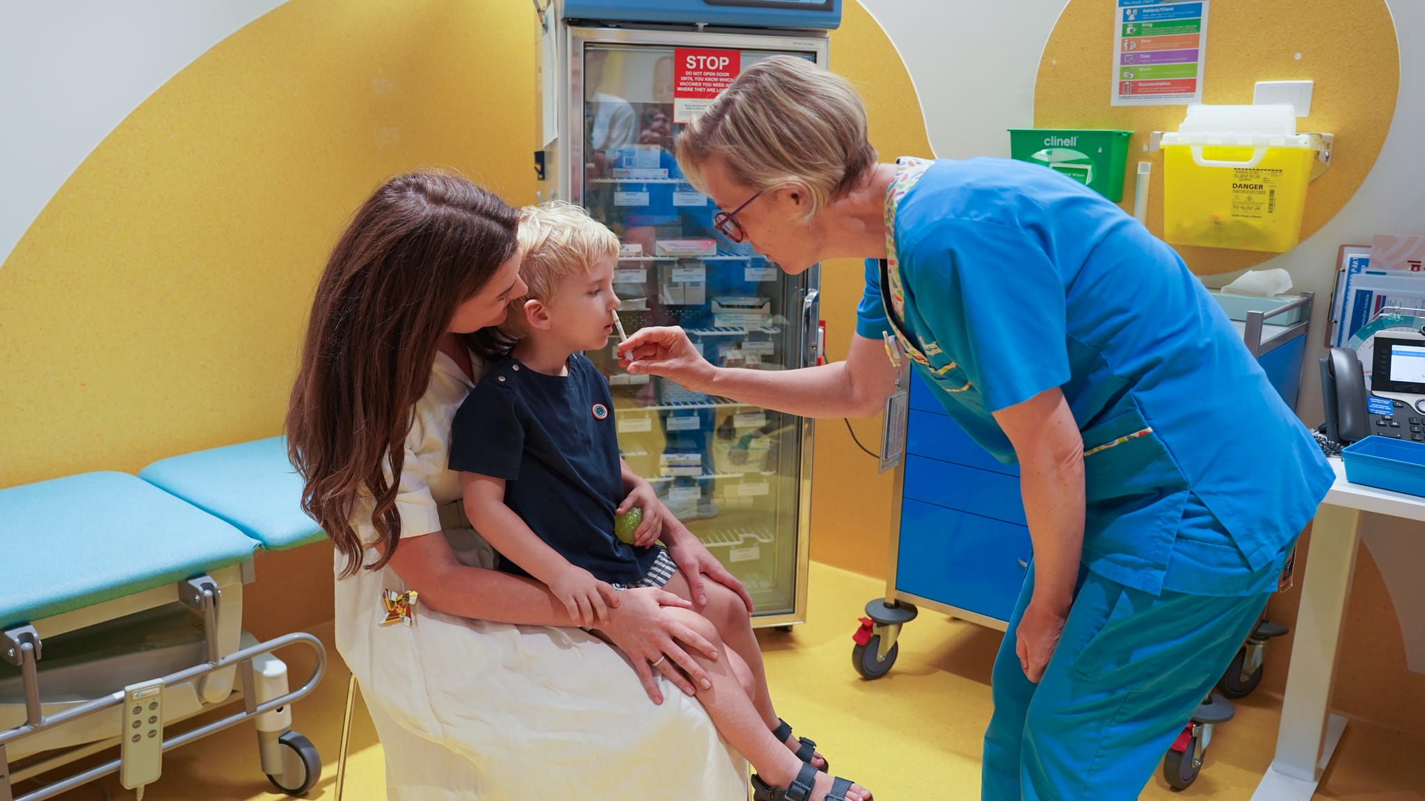 child receiving a flumist vaccine
