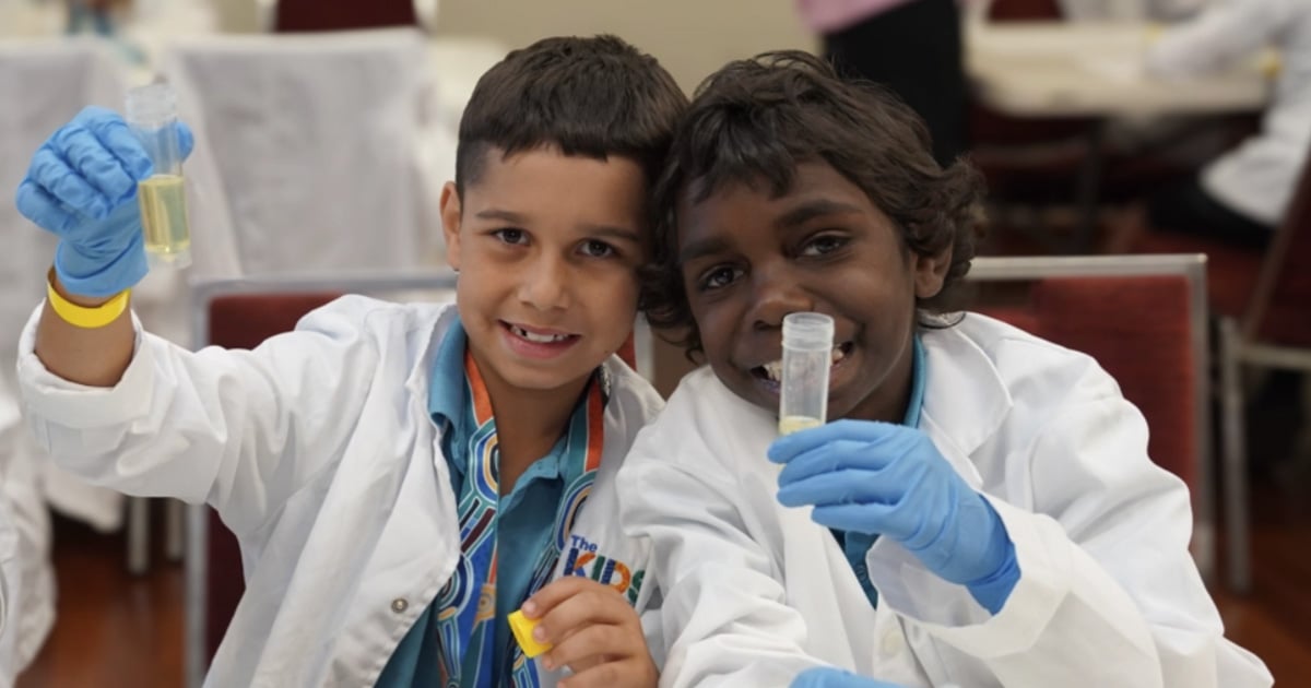 two children holding vials at the STEM festival