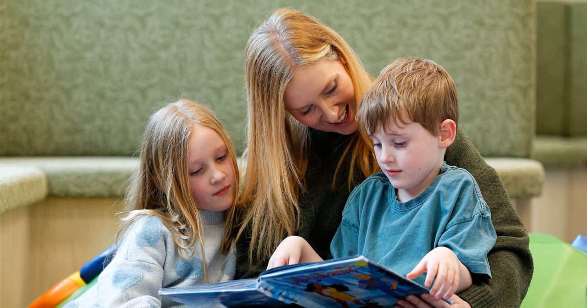 mother reading to children